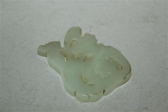 A Chinese pale celadon jade carving of the character Fu, early 20th century, 4.7cm